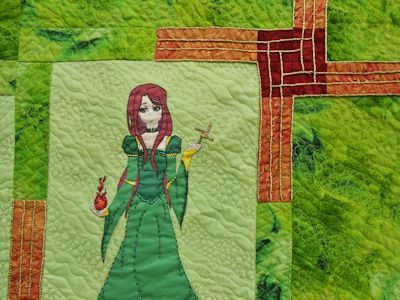 Closeup of Brigid and the pieced & embroidered Cross